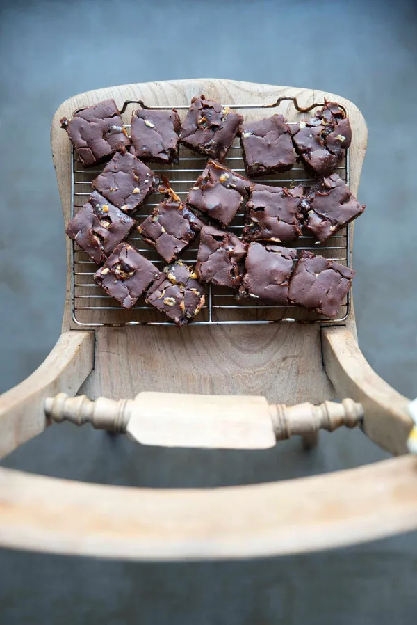 A plate of delicious-looking brownies on an old wooden chair